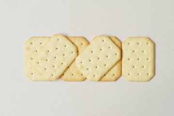 top view of crackers on beige background.