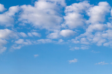 Light blue sky with clouds, can be used as background.