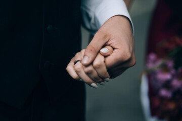 Obraz premium concept of love. hands of brides holding each other. love. wedding.