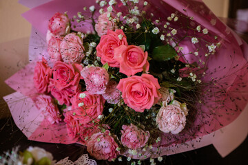 big bridal bouquet with red flowers. wedding day. bride with a bouquet