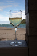 Petrov Bay, Lazovsky Reserve. The sky is reflected in the glass of wine.