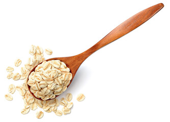 uncooked oatmeal in the wooden spoon, isolated on white, top view