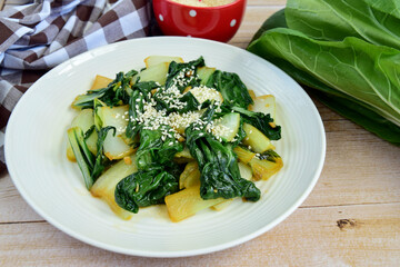 Bok choy vegetables stir fry with soy sauce and sesame seeds