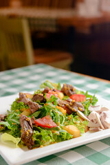 Salad with beef, tomatoes, fresh lettuce salad and arugula, raw mushrooms and great dressing from dijon mustard.