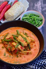 Indonesian tempeh and green bean cooked in spices and coconut milk. 