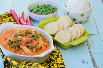 Sayur tempe buncis. Tempeh and green bean cooked in spices and coconut milk. Indonesian food. Served with rice