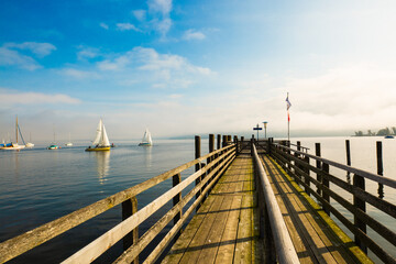 Jetty on Ammersee, foggy day, landscape, blue sky