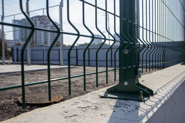 Steel lattice green fence with wire. Fencing. Grid industrial wire fence panels, pvc metal....