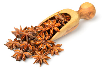 star anise fruits in the wooden scoop, isolated on the white background