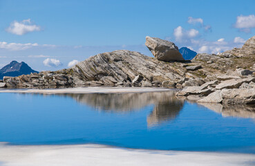 View of idyllic lake in the pass of Monte Moro during summer day of july, Piedmont, Italy