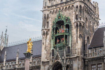 Glockenspiel clock of New Town Hall (Neues Rathaus) Tower and Mariensäule Column - Munich,...
