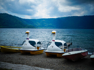 White yellow empty goose pedal boats at Lake Towada in Aomori, Japan