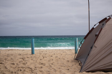 Relaxation by the sea on a sandy beach.
