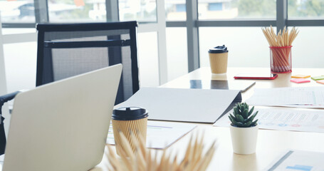 Meeting room Office laptop business financial document chart , graph on wooden table with coffee cup. Flat lay notebook computer laptop on office desk. No people business graph chart on meeting table