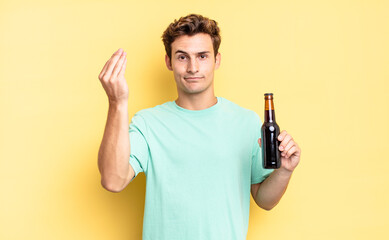 making capice or money gesture, telling you to pay your debts!. beer bottle concept