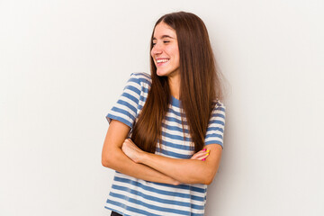 Obraz premium Young caucasian woman isolated on white background smiling confident with crossed arms.