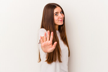 Young caucasian woman isolated on white background rejecting someone showing a gesture of disgust.