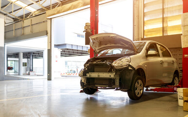 car in automobile repair service center with soft-focus and over light in the background