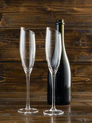 wine glasses with beveled edges on dark wooden background