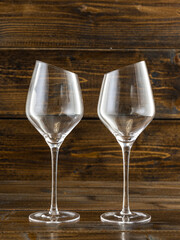 wine glasses with beveled edges on dark wooden background