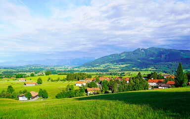 Naklejka premium Panorama landscape in the Allgäu in Bavaria. Nature with mountains, meadows and forests.