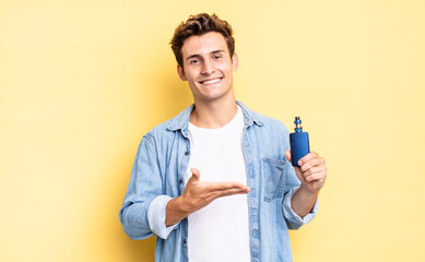 smiling cheerfully, feeling happy and showing a concept in copy space with palm of hand. vaporizer...