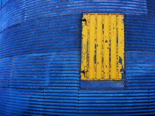 Yellow Painted Door on Steel Grain Silo Granary Texture