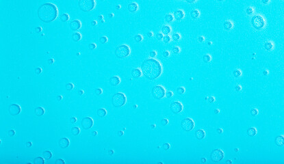Blue liquid abstract background. Bubbles and textures of water on a blue background 