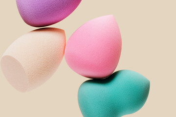 Colored cosmetic beauty blender sponges Green, violet, pink, rainbow colored sponges different shape.