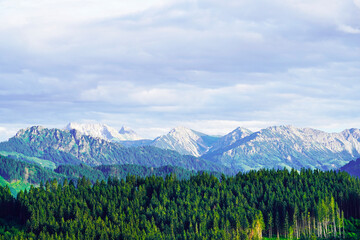Obraz premium Panorama landscape in the Allgäu in Bavaria. Nature with mountains, meadows and forests.