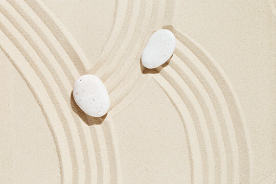 Zen garden meditation sandy background  White stone and lines on sand