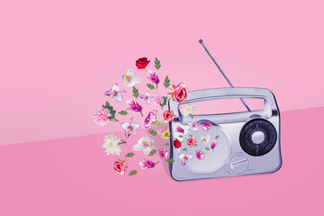 Beautiful gray retro style radio receiver with many different colorful flowers and green leaves on...