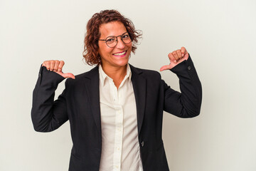 Middle age latin business woman isolated on white background feels proud and self confident, example to follow.