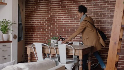beautiful young woman getting ready leaving apartment with bicycle late for work