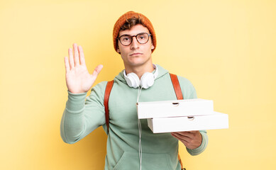 looking serious, stern, displeased and angry showing open palm making stop gesture. pizza concept