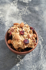 Healthy baking cookies. Oatmeal and honey sweets. Cranberry and nuts energy. Natural raw snack. Tasty cuisine. Vegerarian food. Delicious banana and flake granola