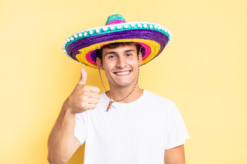 feeling proud, carefree, confident and happy, smiling positively with thumbs up. mexican hat concept