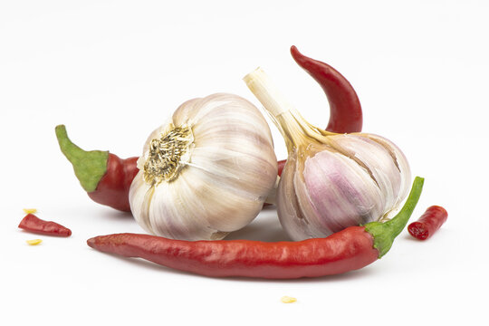 Garlic and hot peppers isolated on a white background.