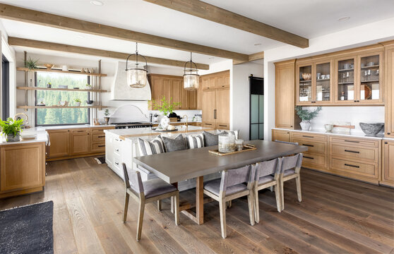 Traditional Kitchen In New Luxury Home With Hardwood Floors, Wood Beams, Large Island And Quartz Counters