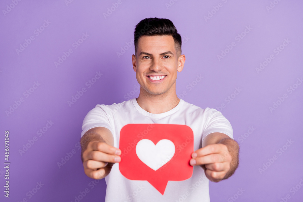 Wall mural photo of young man happy positive smile show heart like icon blogger click advise advert isolated ov