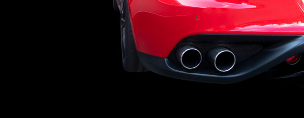 Close up of a car dual exhaust pipe. Double exhaust pipes of a red modern sports car. Car exterior...