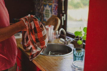 Fototapeta na wymiar Man washing dishes at home 