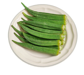 fresh okra, Abelmoschus esculentus in a creamy dish isolated on a white background with clipping path