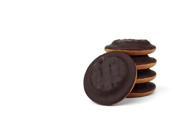 Pile of chocolate biscuit cookies with orange jam isolated on white background.