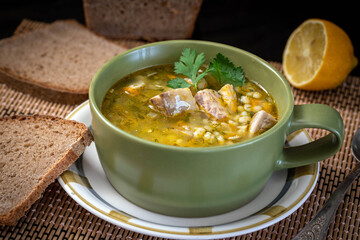 Mackerel fish soup with lemon and country bread.