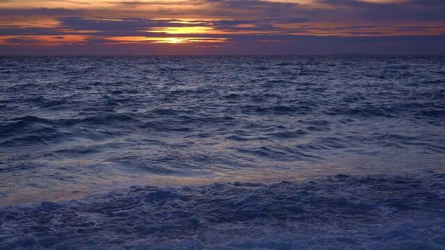 Slow motion of the ocean surface at sunset. Filmed at Looc beach in Surigao Philippines
