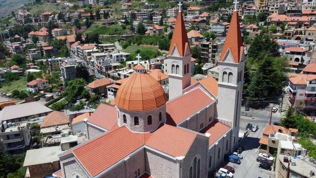 Aerial View Of Saint Saba Cathedral, A Maronite Church In Bsharri Town Near Kadisha Valley In Lebanon. pullback ascend