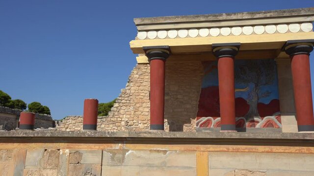 Telephoto shot of the north entrance to the Minoan Palace of Knossos in Heraklion, Crete, Greece with the charging bull fresco. Knossos is the largest Bronze Age archaeological site in Crete.