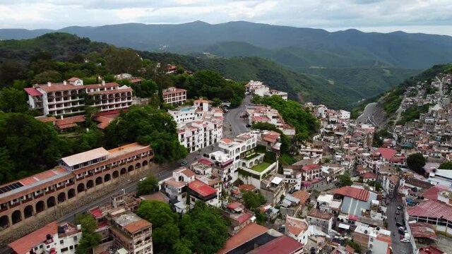 Aerial panorama over the city and landscapes of Taxco Mexico.