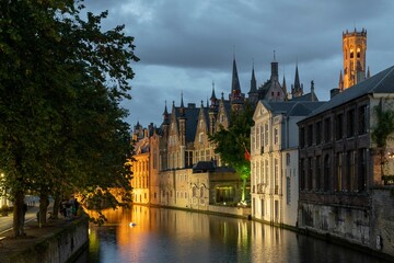 Fototapeta na wymiar Bruges, Belgium. September 30, 2019: Arched bridge in the canals of Bruges.